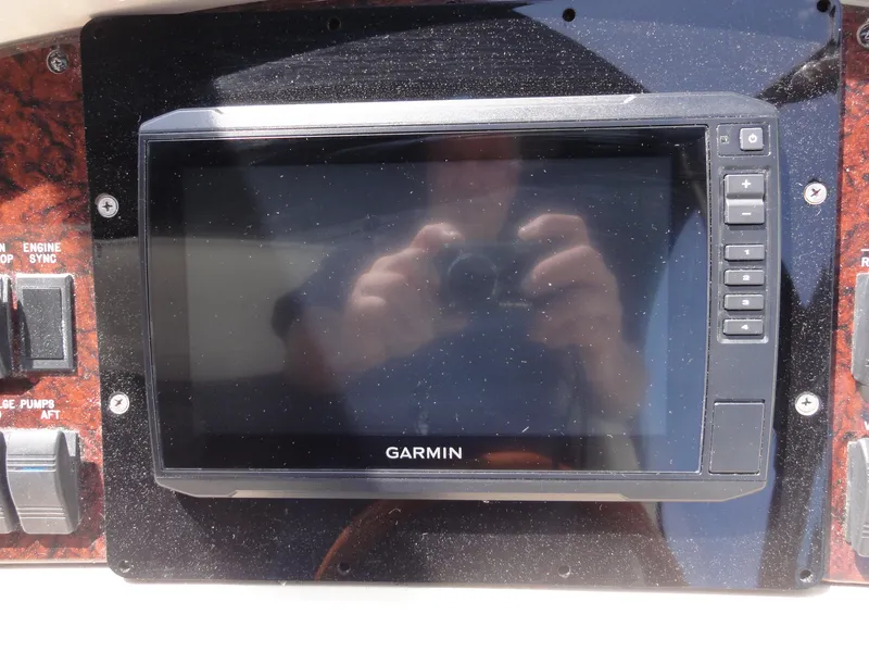 Slide: The Image of Garmin navigation system on 2003 Sea Ray 380 Sundancer boat dashboard. - 16