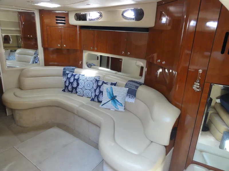 Slide: The Image of Luxurious interior of 2003 Sea Ray 380 Sundancer with leather seating and decorative pillows. - 21