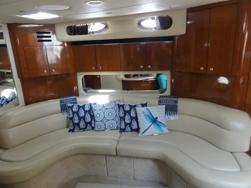 Slide: The Image of Luxurious interior of 2003 Sea Ray 380 Sundancer with plush seating and decorative pillows. - 23
