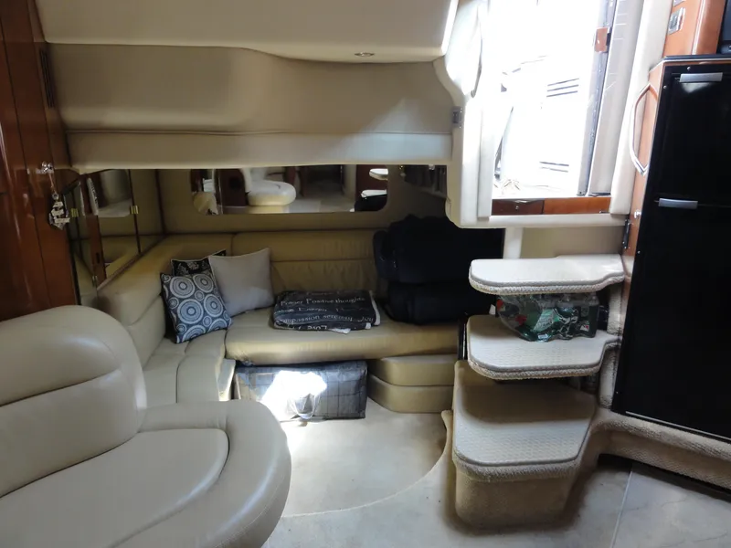 Slide: The Image of Interior of 2003 Sea Ray 380 Sundancer yacht with beige seating and modern design. - 24