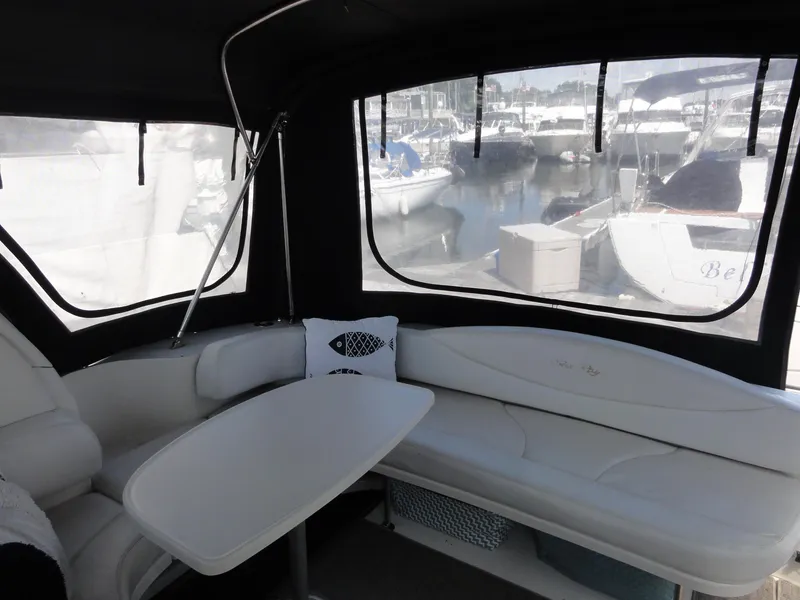 Slide: The Image of Interior of 2003 Sea Ray 380 Sundancer yacht with seating and marina view. - 3