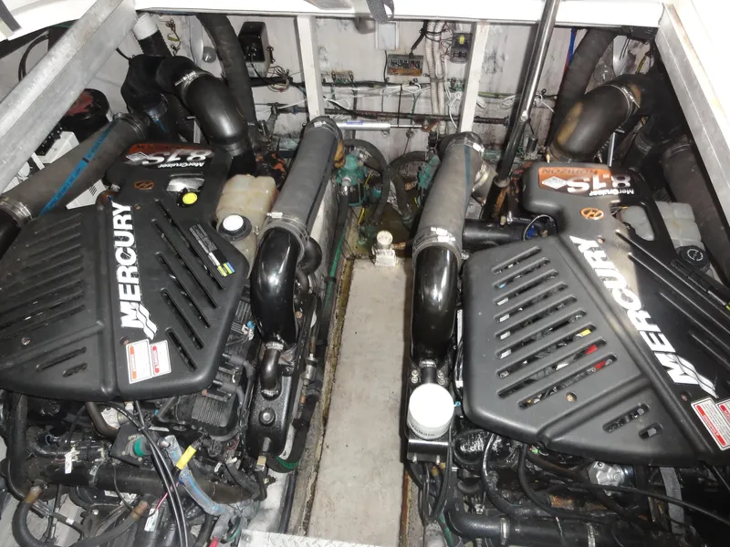 Slide: The Image of Engine room of 2003 Sea Ray 380 Sundancer with twin Mercury engines. - 32