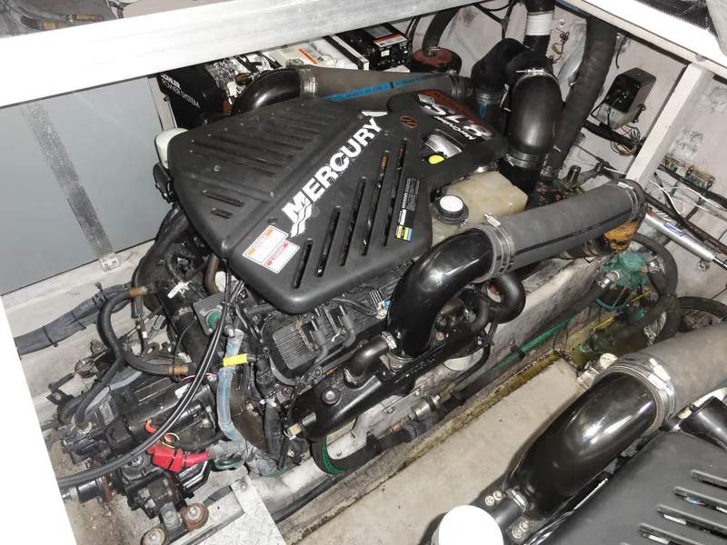 Slide: The Image of Engine compartment of a 2003 Sea Ray 380 Sundancer with a Mercury engine. - 33