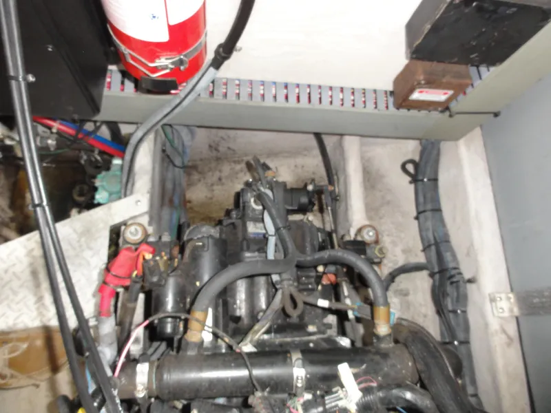 Slide: The Image of Engine compartment of a 2003 Sea Ray 380 Sundancer with visible fire extinguisher. - 35
