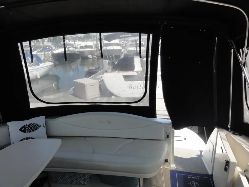 Slide: The Image of Interior view of 2003 Sea Ray 380 Sundancer yacht with marina backdrop. - 4
