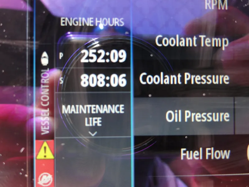 Slide: The Image of Display screen showing engine hours and maintenance data for 2003 Sea Ray 380 Sundancer. - 40