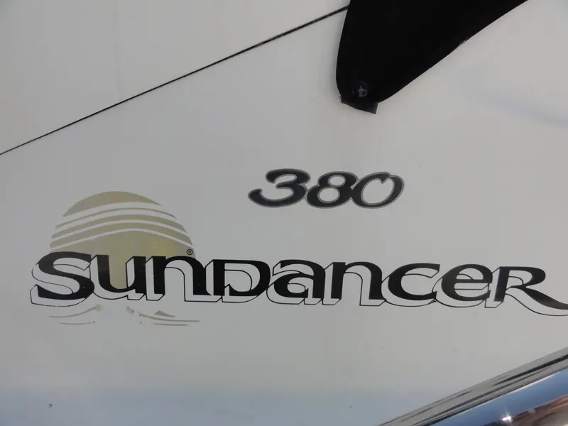 Slide: The Image of 2003 Sea Ray 380 Sundancer logo on boat exterior. - 41