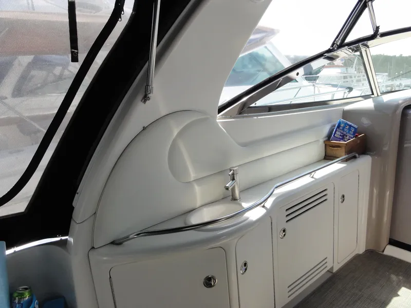 Slide: The Image of 2003 Sea Ray 380 Sundancer interior with sink and storage cabinets. - 8
