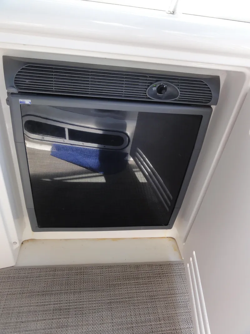 Slide: The Image of Compact refrigerator on 2003 Sea Ray 380 Sundancer yacht, interior view. - 9
