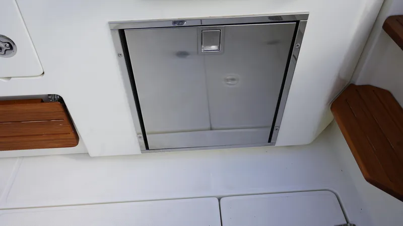 Slide: The Image of Stainless steel hatch on 2020 Boston Whaler 350 Realm boat deck. - 32