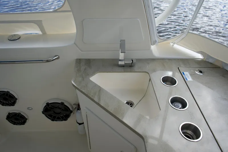 Slide: The Image of 2020 Boston Whaler 350 Realm boat interior with sink and countertop. - 35