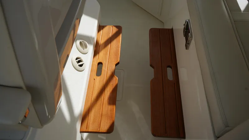 Slide: The Image of 2020 Boston Whaler 350 Realm interior with wooden floor panels and ventilation. - 36