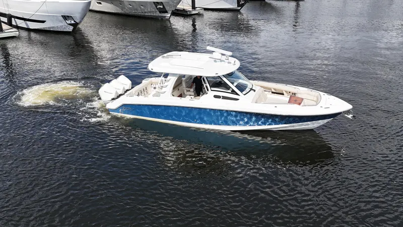 Slide: The Image of 2020 Boston Whaler 350 Realm boat cruising on calm water. - 4