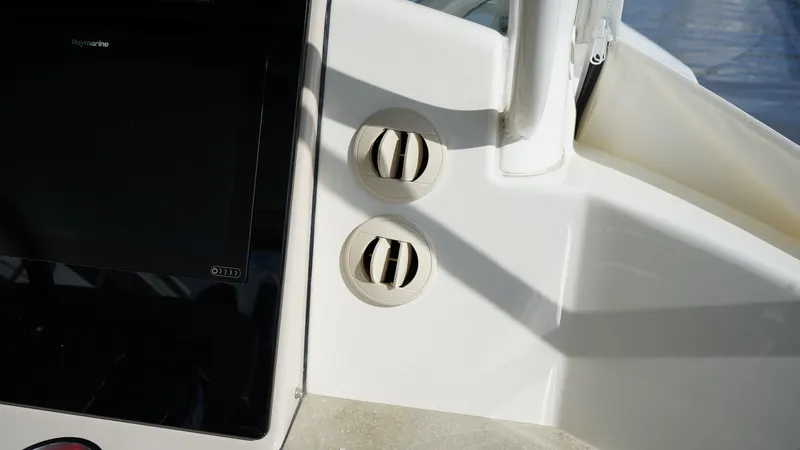 Slide: The Image of Control panel and air vents on a 2020 Boston Whaler 350 Realm boat. - 43