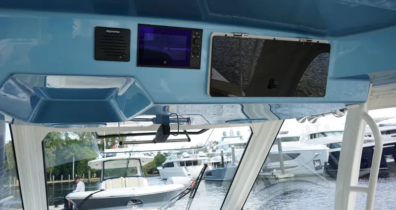 Slide: The Image of Interior view of a 2020 Boston Whaler 350 Realm boat with navigation equipment. - 44