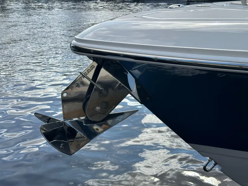 Slide: The Image of 2020 Boston Whaler 350 Realm boat with stainless steel anchor on calm water. - 46