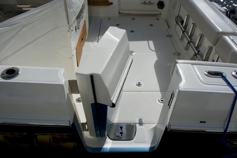 Slide: The Image of 2020 Boston Whaler 350 Realm boat deck with seating and storage compartments. - 49