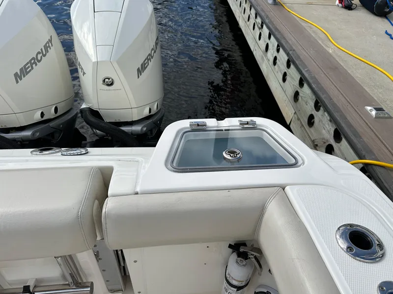 Slide: The Image of Boston Whaler 350 Realm 2020 boat with twin Mercury engines at dock. - 50