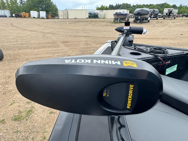 Slide: The Image of Minn Kota PowerDrive motor on 2026 Tracker Targa V-18 Combo boat in a storage yard. - 12