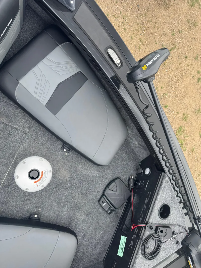 Slide: The Image of 2026 Tracker Targa V-18 Combo boat interior with Minn Kota trolling motor. - 14