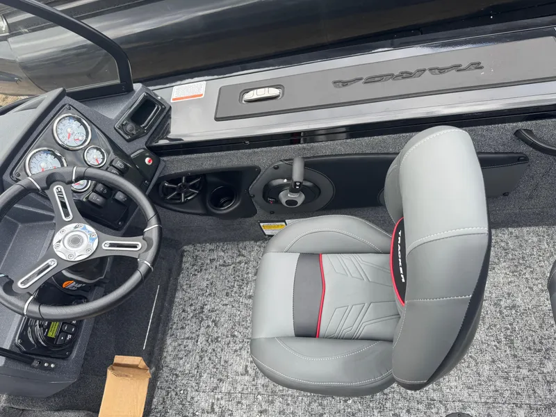 Slide: The Image of 2026 Tracker Targa V-18 Combo boat interior with steering wheel and seat. - 7