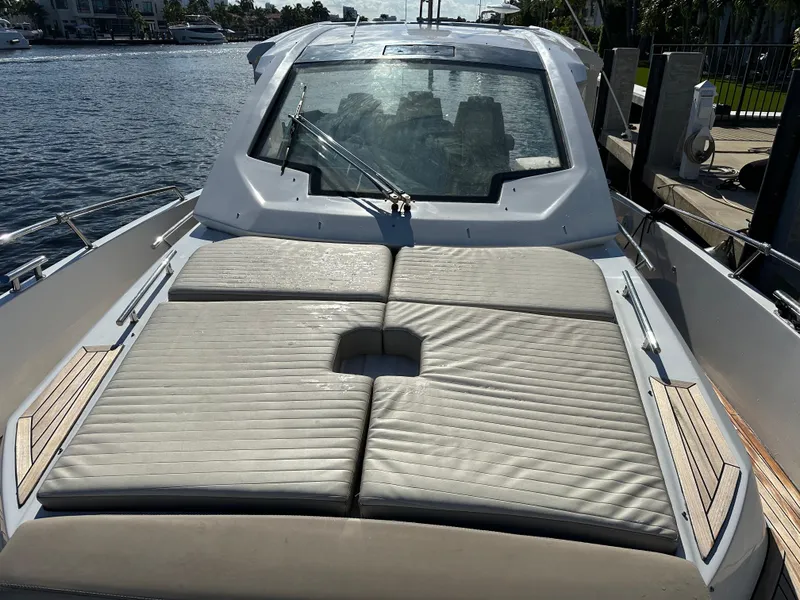 Slide: The Image of 2018 Azimut Verve 40 yacht with sunbathing deck, docked by the water. - 10