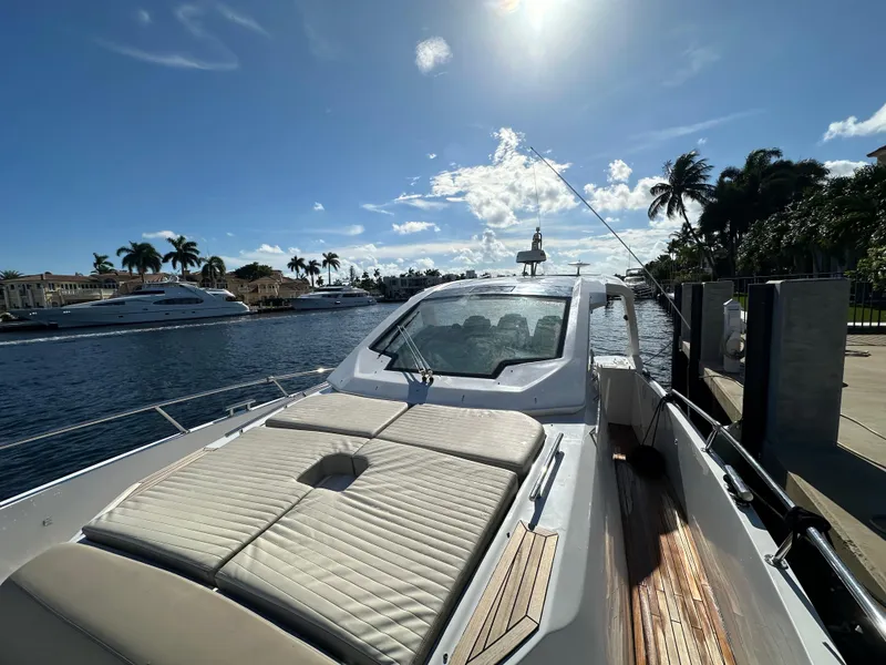 Slide: The Image of 2018 Azimut Verve 40 yacht docked under sunny skies, with palm trees and waterway views. - 11