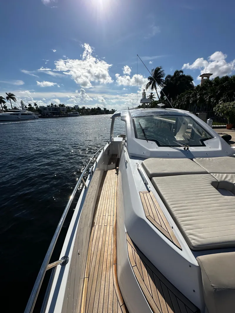 Slide: The Image of 2018 Azimut Verve 40 yacht on sunny waterfront with palm trees. - 12