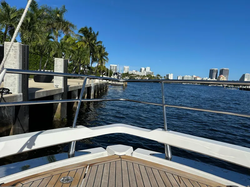 Slide: The Image of Bow view from 2018 Azimut Verve 40 yacht, overlooking a sunny waterfront cityscape. - 13
