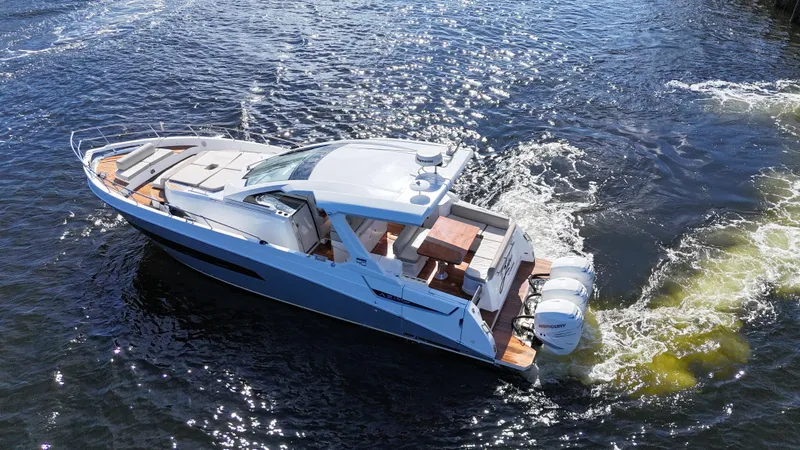 Slide: The Image of 2018 Azimut Verve 40 yacht cruising on open water, showcasing sleek design and powerful engines. - 2
