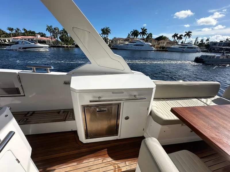 Slide: The Image of 2018 Azimut Verve 40 yacht deck with seating and waterfront view. - 22