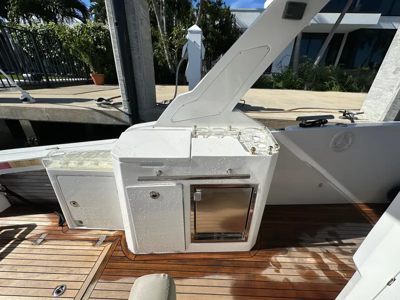 Slide: The Image of Outdoor kitchen area on 2018 Azimut Verve 40 yacht with wooden deck. - 24