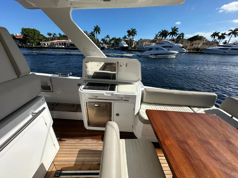 Slide: The Image of Luxurious 2018 Azimut Verve 40 yacht interior with outdoor kitchen and scenic waterfront view. - 25