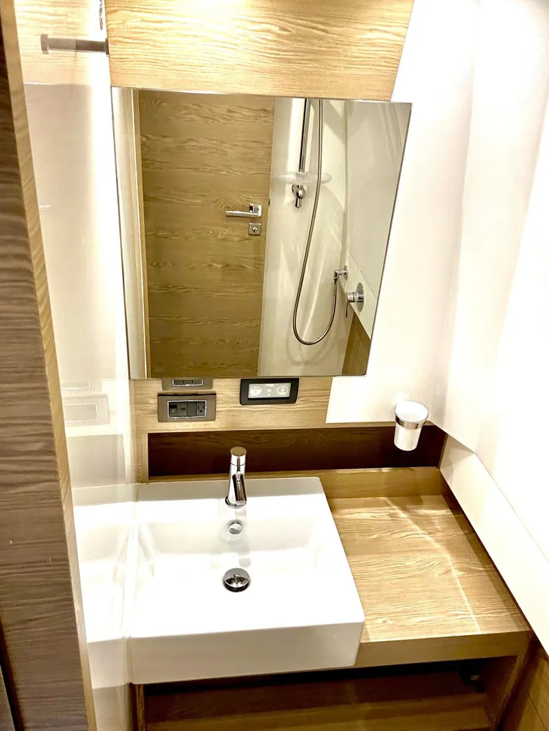 Slide: The Image of Modern bathroom interior on 2018 Azimut Verve 40 yacht, featuring sleek sink and mirror. - 38