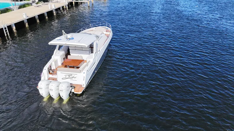 Slide: The Image of 2018 Azimut Verve 40 yacht cruising on open water, rear view. - 5