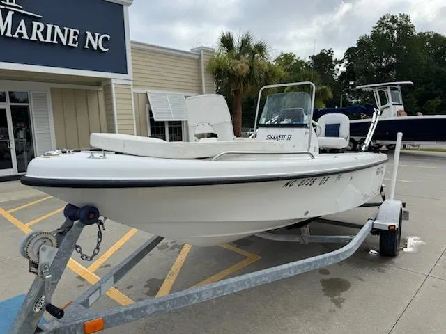 Slide: The Image of 2007 Sea Fox 16CC boat on trailer outside marine store. - 4