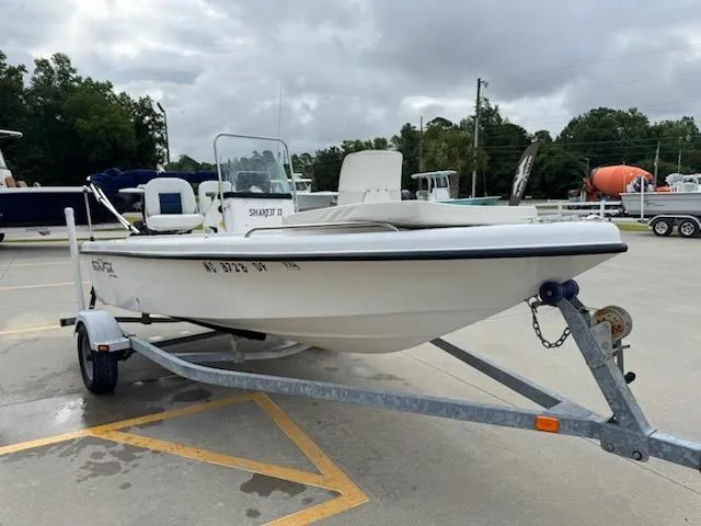 Slide: The Image of 2007 Sea Fox 16CC boat on trailer in parking lot, overcast sky. - 6