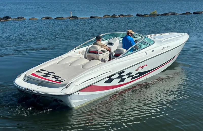 Slide: The Image of 2000 Baja 342 speedboat on water, featuring sleek design and checkered graphics. - 14