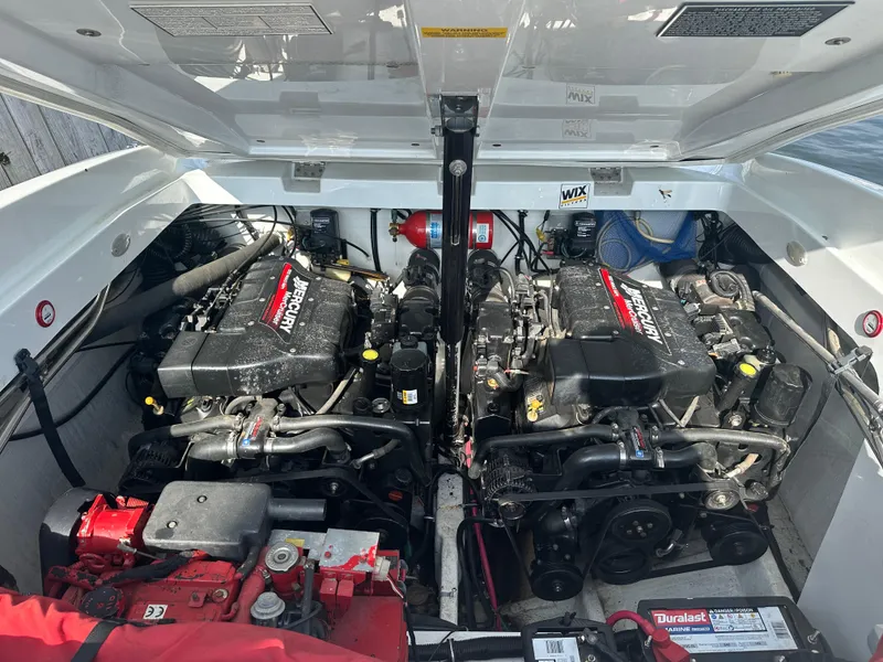 Slide: The Image of Engine compartment of a 2000 Baja 342 boat with dual Mercury engines. - 38