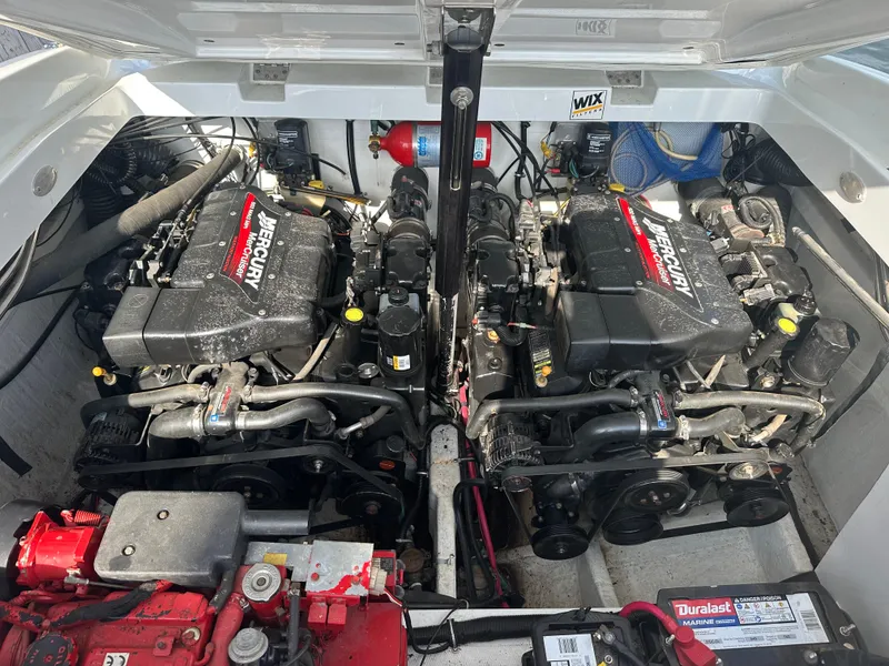 Slide: The Image of Engine compartment of a 2000 Baja 342 boat with dual Mercury engines. - 39