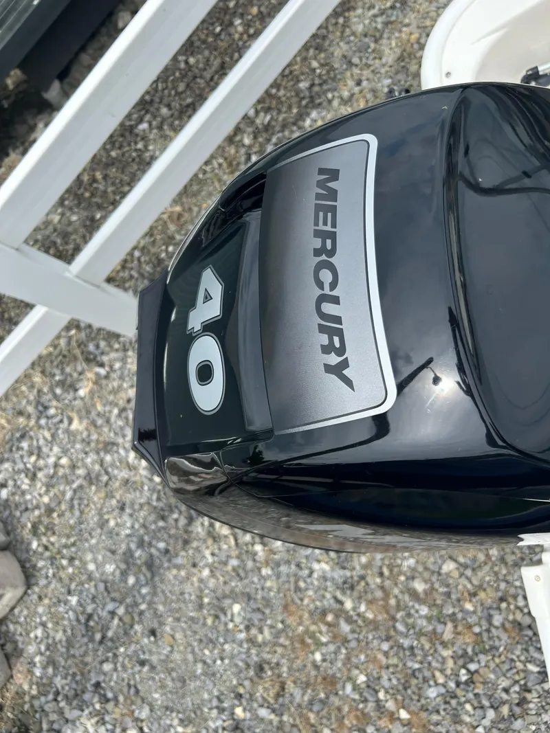 Slide: The Image of Mercury 40 horsepower outboard motor on 2018 Boston Whaler 130 Super Sport. - 7