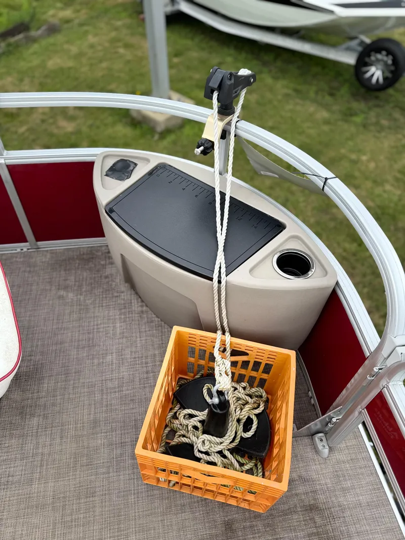 Slide: The Image of 2022 Sun Tracker Bass Buggy 18 DLX boat with anchor rope in orange basket. - 26