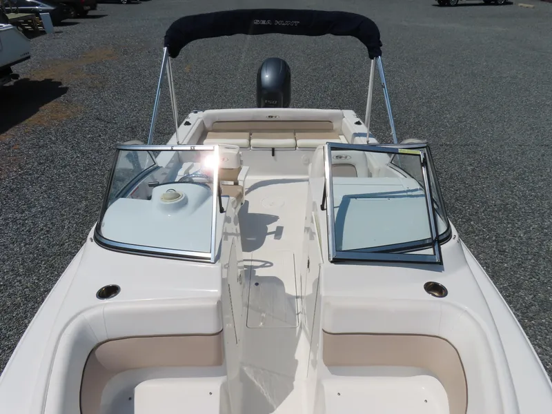 Slide: The Image of 2013 Sea Hunt Escape 211 LE boat interior with open windshield and seating. - 14