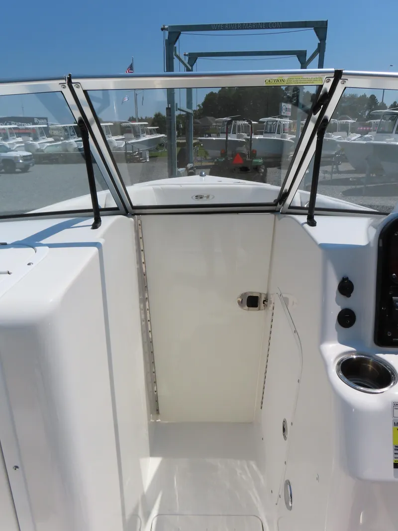 Slide: The Image of 2013 Sea Hunt Escape 211 LE boat interior with windshield and control panel. - 15