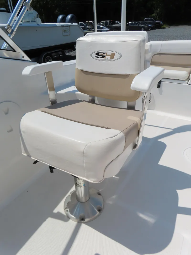Slide: The Image of 2013 Sea Hunt Escape 211 LE boat seat with armrests and logo. - 27