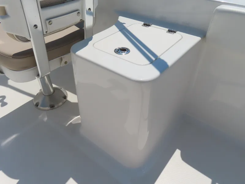 Slide: The Image of 2013 Sea Hunt Escape 211 LE boat seat and storage compartment. - 28