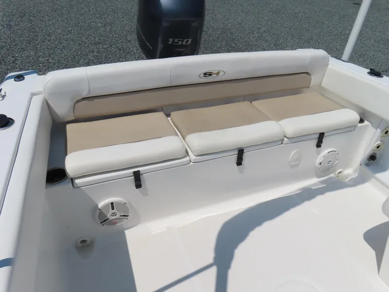 Slide: The Image of 2013 Sea Hunt Escape 211 LE boat seating area with cushioned bench and Yamaha 150 engine. - 30