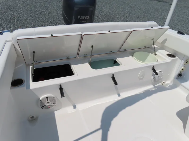Slide: The Image of 2013 Sea Hunt Escape 211 LE boat storage compartments and Yamaha 150 engine. - 32