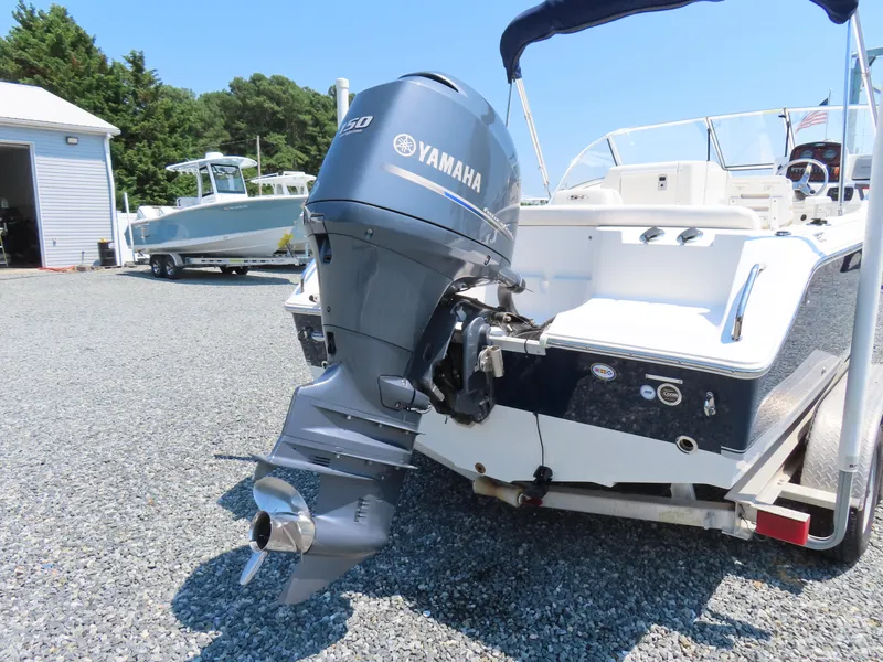 Slide: The Image of 2013 Sea Hunt Escape 211 LE boat with Yamaha outboard motor on trailer. - 4