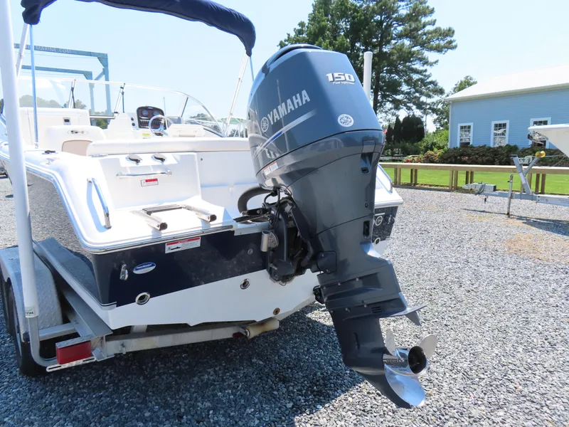 Slide: The Image of 2013 Sea Hunt Escape 211 LE boat with Yamaha 150 engine on trailer. - 5